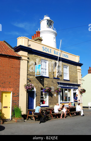The Lighthouse and Sole Bay Inn from East Green, Southwold, Suffolk, England, United Kingdom Stock Photo