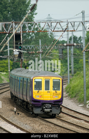 class 319 train in first capital connect livery travelling beneath catenary in the uk Stock Photo