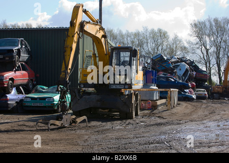 Piles of scrap cars in a scrapyard Stock Photo