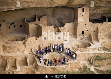 Tourists viewing kiva at Cliff Palace cliff dwelling Indian ruin, Mesa Verde National Park, Colorado Stock Photo