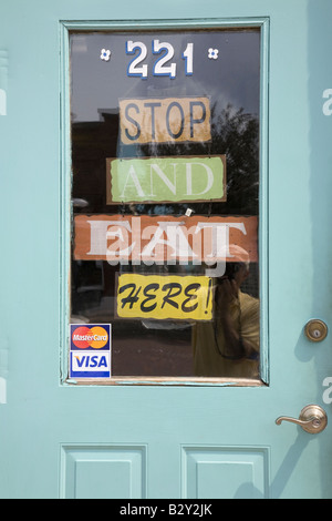 Sign on the door of 'Aunt B'  restaurant that reads 'Stop and Eat Here' in Walnut, Iowa Stock Photo