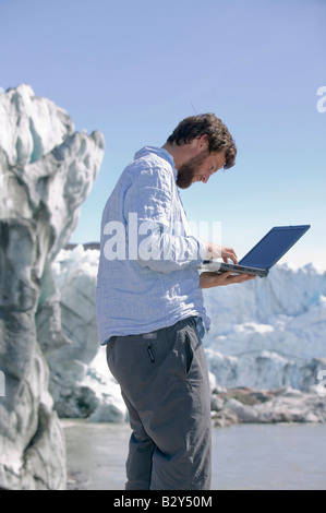 scientist working on a research project on the Russell Glacier in Greenland to study how climate change is speeding it up Stock Photo