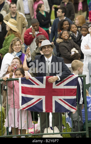 Onlooker displaying Union Jack British Flag near VA State Capitol in Richmond VA and the arrival of Queen Elizabeth II Stock Photo