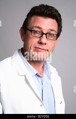 Male 40 something doctor smiling wearing a white coat -glasses Stock Photo