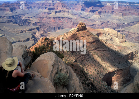 A hiker enjoys the view from Ooh Ahh point on the South Kaibab Trail in the Grand Canyon Stock Photo