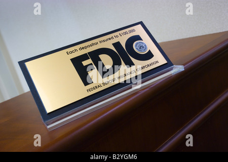 FDIC plaque resting on a bank counter top Stock Photo