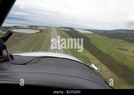 K-Bay Air air plane (Cessna 2007) landing on airstrip in Homer, Alaska, US Stock Photo