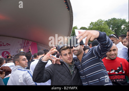 Asian youth during music festival at London Mela Festival at Gunnesbury Park Ealing London United Kingdom Stock Photo