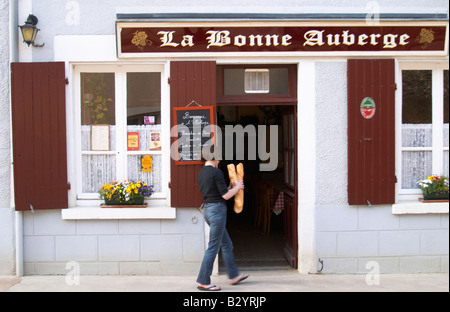 La Bonne Auberge restaurant. Woman with french baguette bread. Chavignol, Sancerre, Loire, France Stock Photo