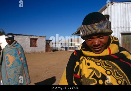 Man wrapped in basotho blanket in rural village, portrait, Lesotho, Africa Stock Photo