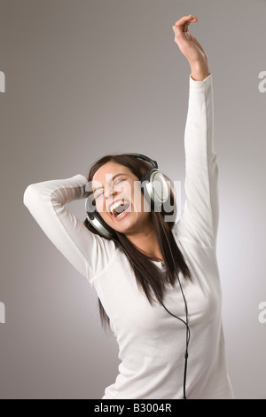 Woman Listening to Music with Headphones Stock Photo
