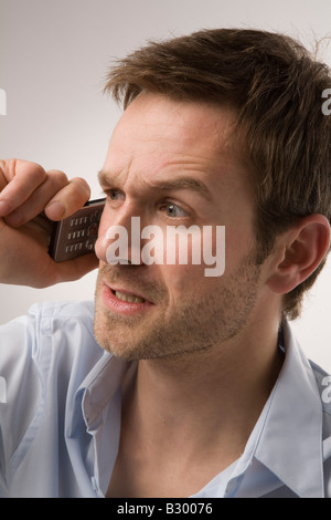 Angry Man Talking on Cell Phone Stock Photo