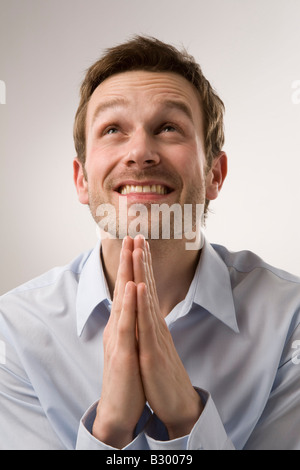 Portrait of Man Praying Stock Photo