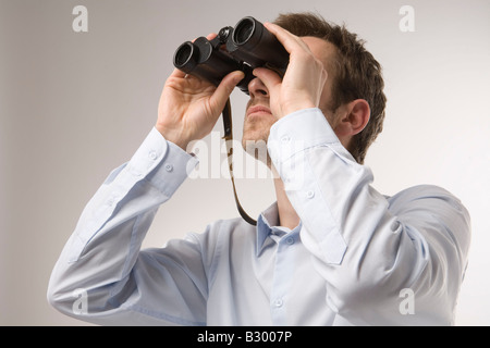 Man Using Binoculars Stock Photo
