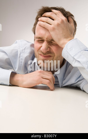 Portrait of Man With Headache Stock Photo