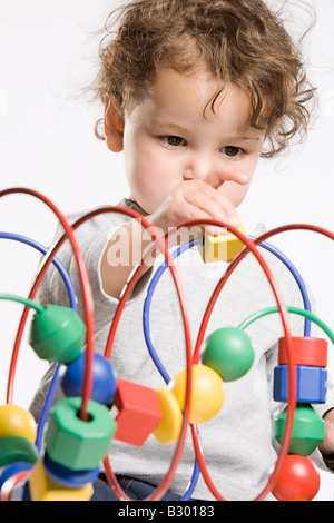 Little Girl Playing With Toy Stock Photo