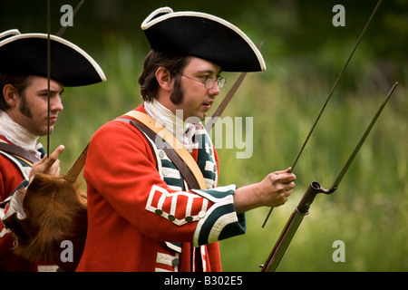 Members of the 68th Durham Light Infantry Display Team wear replica uniforms of the the mid Eighteenth century (c 1758). Stock Photo