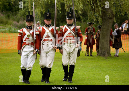 Members of the 68th Durham Light Infantry Display Team wear replica uniforms of the Napoleonic War era. Stock Photo