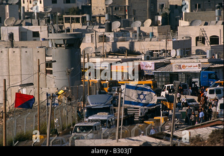 Traffic, congestion and busy security controls. Israeli settlement, Palestine. Stock Photo