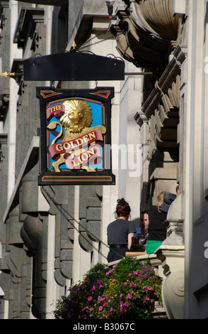 Customers sitting on balcony of Golden Lion pub in King Street, St James's, London, England Stock Photo