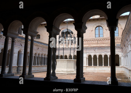 The Abbazia di Santa Croce in Sassovivo near Foligno in Umbria Italy. Benedictine Abbey on the slopes of Mount Serrone  It was founded by the Benedictine children around the year 1070, probably by monaco Meinhard, that perhaps came from Sitria country on the slopes of Mount Catria. La costruzione venne basata su una preesistente rocca fortificata posseduta dai Monaldi, donata al monaco dal proprietario di allora, il conte Ugolino di Uppello, in precedenza vi si trovava probabilmente un santuario umbro . The construction was based on a pre-existing fortified fortress controlled by Monaldi, dona Stock Photo