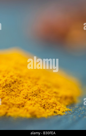 Curcuma longa. Turmeric powder on slate. Selective focus Stock Photo