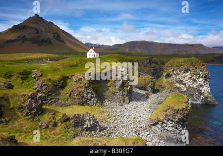 Icelandic landscape from the Snaefellsnes Peninsula of Iceland showing Arnarstapi and the mountain Stapafell Stock Photo