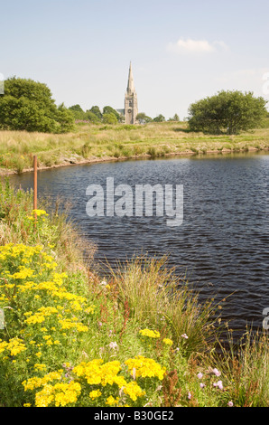 St Peters church Belmont from Wards reservoir known locally as the Blue Lagoon Lancashire Stock Photo