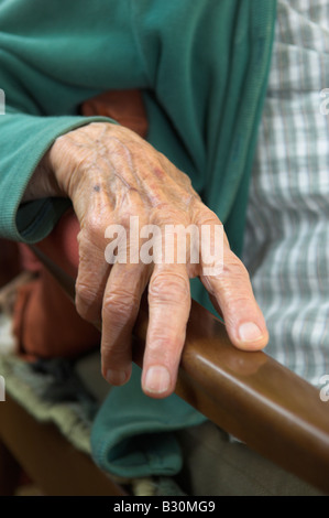 Closeup of hand on chair armrest 92 year old elderly woman Stock Photo