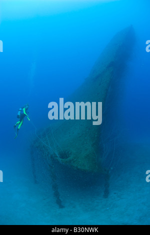 Diver at Bow of USS Arkansas Battleship Marshall Islands Bikini Atoll Micronesia Pacific Ocean Stock Photo