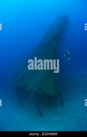 Diver at Bow of USS Arkansas Battleship Marshall Islands Bikini Atoll Micronesia Pacific Ocean Stock Photo