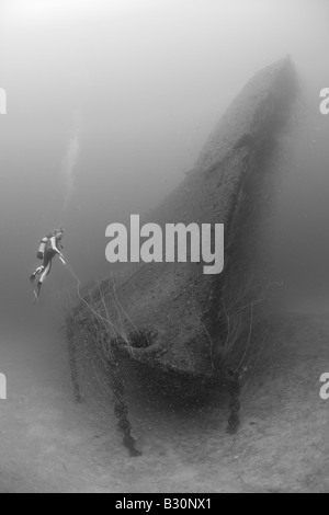 Diver at Bow of USS Arkansas Battleship Marshall Islands Bikini Atoll Micronesia Pacific Ocean Stock Photo