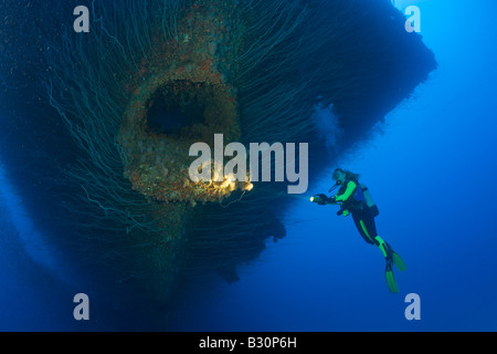 Diver at Anchor Hawse Hole at Bow of USS Saratoga Marshall Islands Bikini Atoll Micronesia Pacific Ocean Stock Photo
