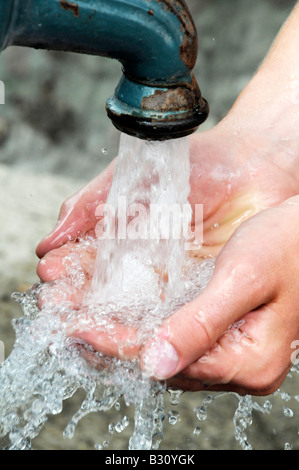 HANDFUL OF WATER FROM WATER FOUNTAIN Stock Photo