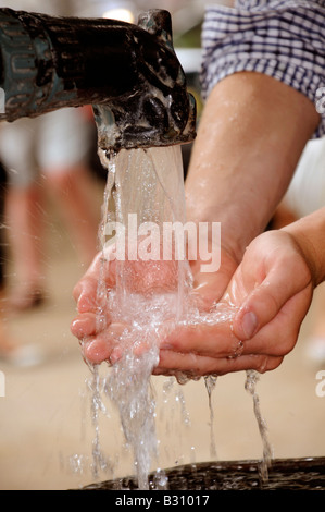 HANDFUL OF WATER FROM WATER FOUNTAIN Stock Photo