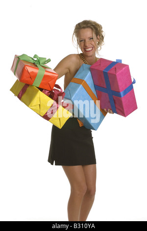 young woman clad in a party dress with some gift boxes Stock Photo