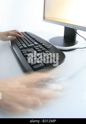 hands on a key pad Stock Photo