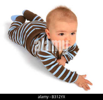 baby in a romper suit lying on its belly Stock Photo