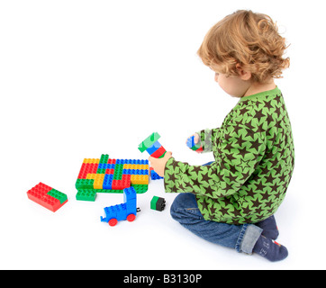 little boy playing with Lego bricks Stock Photo