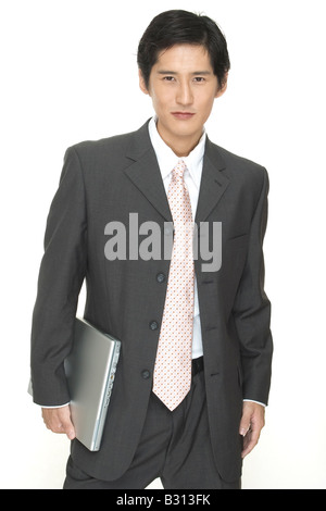 an asian businessman with a laptop computer Stock Photo
