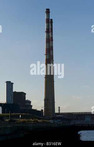 Poolbeg Power Generating Station smoke chimneys in Dublin Bay. Stock Photo