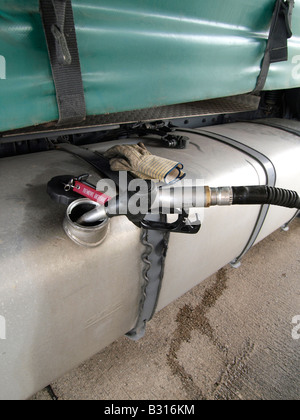 Filling up the tank of a large truck with diesel fuel in Hazeldonk near the Dutch Belgian border nobody Stock Photo