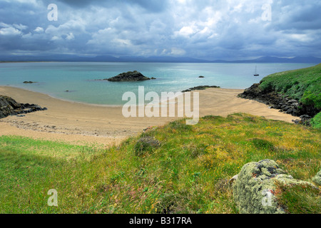 Porth Y Clochydd on Llanddwyn Island off the coast of Anglesey at Newborough Warren Stock Photo