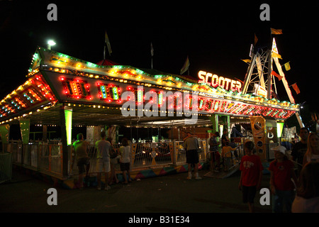 Bumper cars or scooters funfair ride at night. Stock Photo