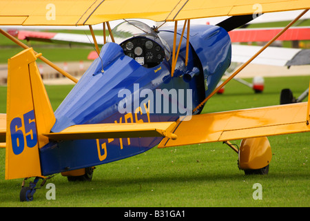 A blue and yellow Andreasson bi-plane in close up Stock Photo