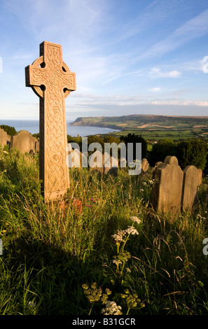 Cross in graveyard overlooking graveyard Stock Photo