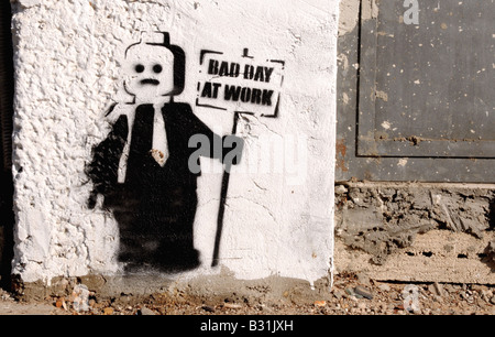 Graffiti stencil found in funky Tel Aviv, of a 'Lego' man holding a sign saying 'Bad Day At Work'. Stock Photo