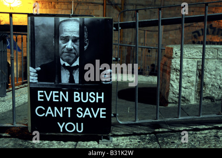 Poster in Jerusalem during the visit of George W. Bush, depicting Prime Minister Ehud Olmert, saying 'Even Bush Can't Save You'. Stock Photo