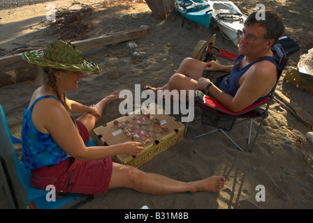 playing chess on a sandy beach with local pieces Stock Photo