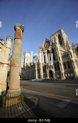 City of York, England. An excavated Roman column and the southern façade of York Minster Cathedral at Minster Yard. Stock Photo